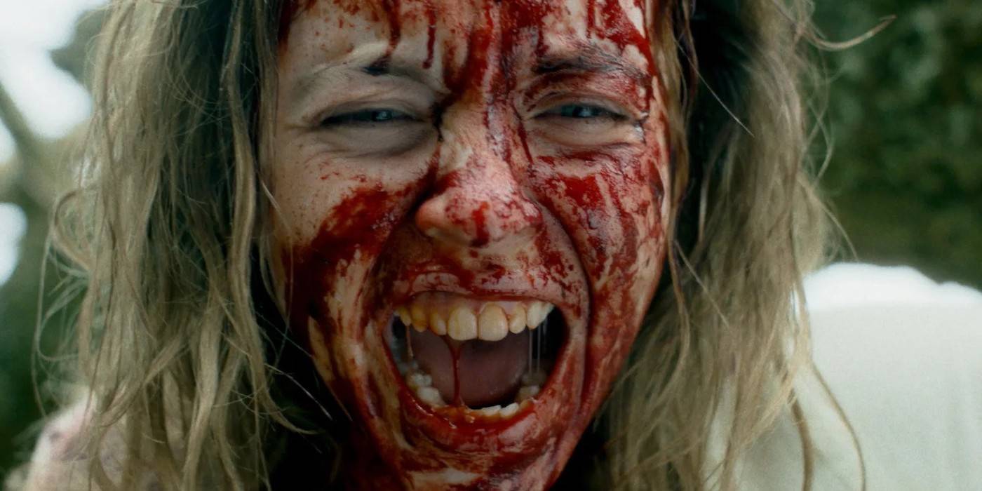 Cecilia, played by actor Sydney Sweeney, screaming with her face covered in blood in Immaculate. 