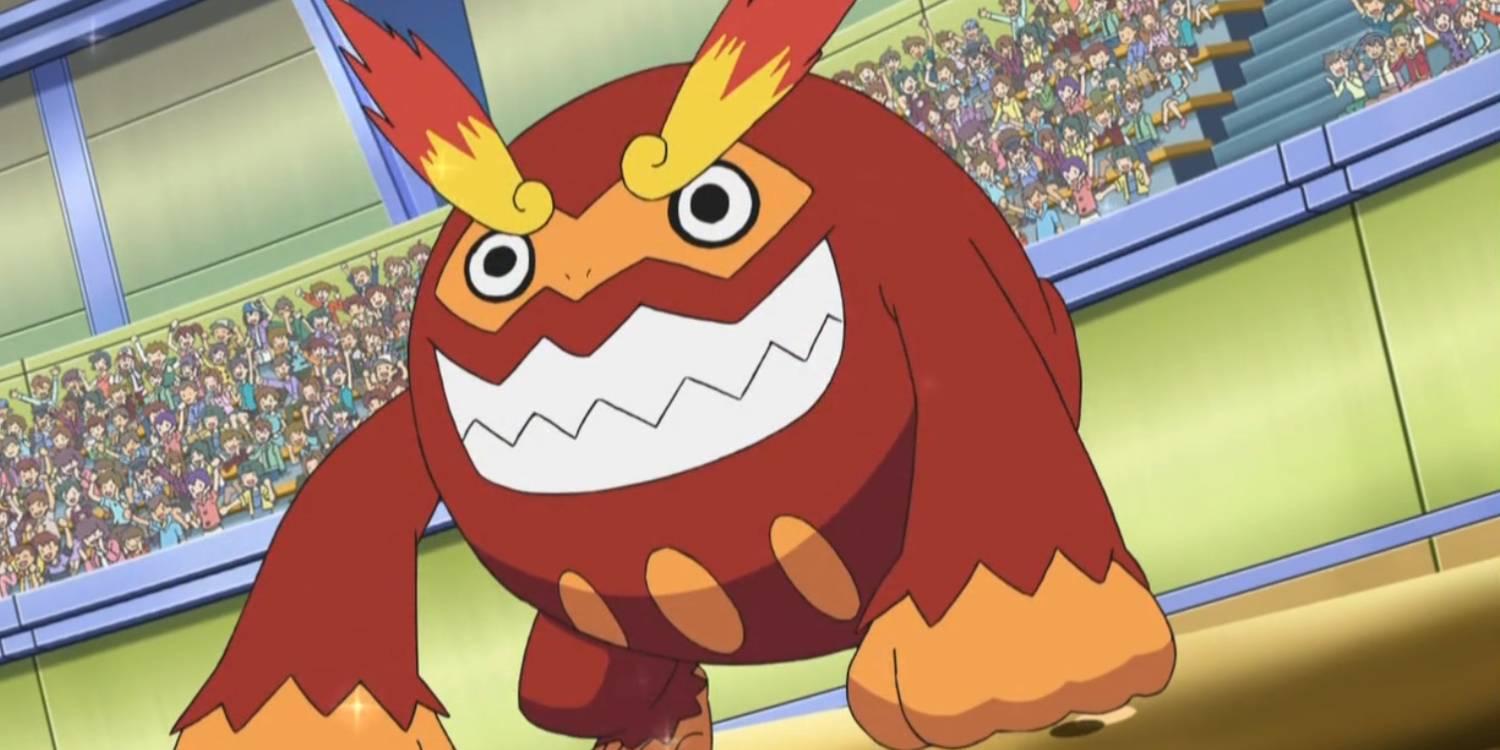 15 Pokémon do tipo Fire mais fortes: Charizard lidera Darmanitan smiles and sits in a crowded stadium in the Pokémon anime.