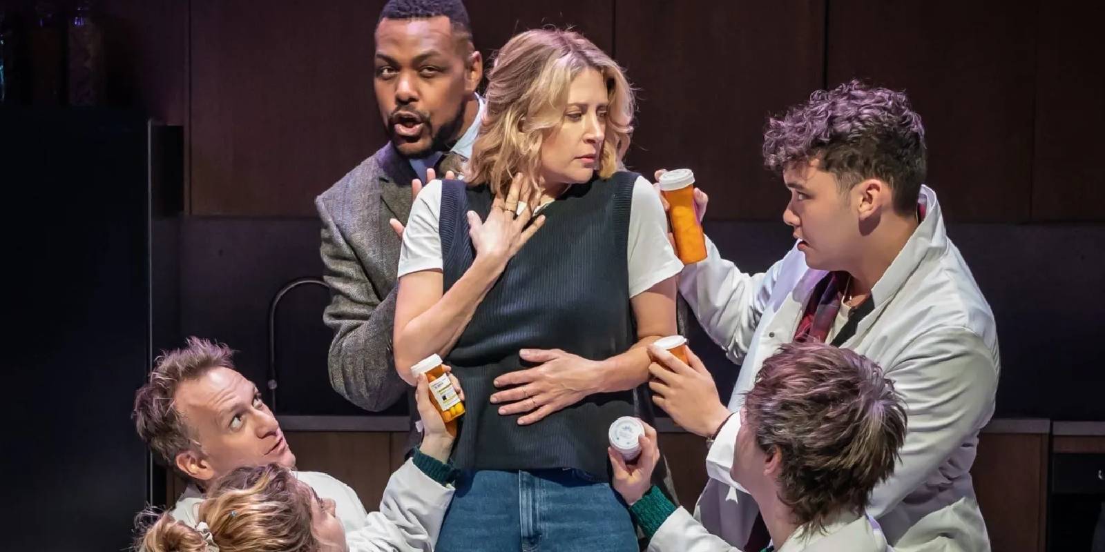 Diana Goodman is surrounded by doctors with pills in the Next to Normal proshot
