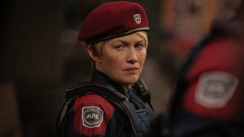Celia wearing her Peacekeeper Security Force cap and uniform in <a href=