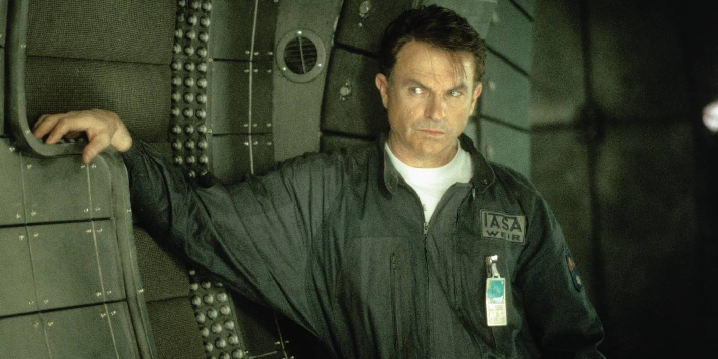 Sam Neill wears a space uniform and looks anxious in Event Horizon.