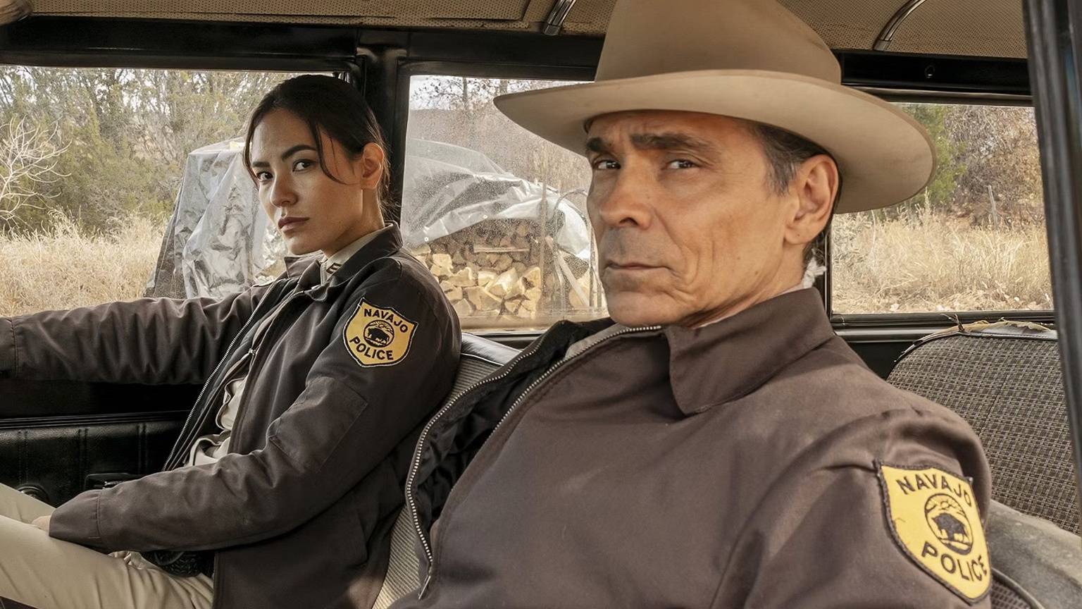 Two cops in a car in <a href=